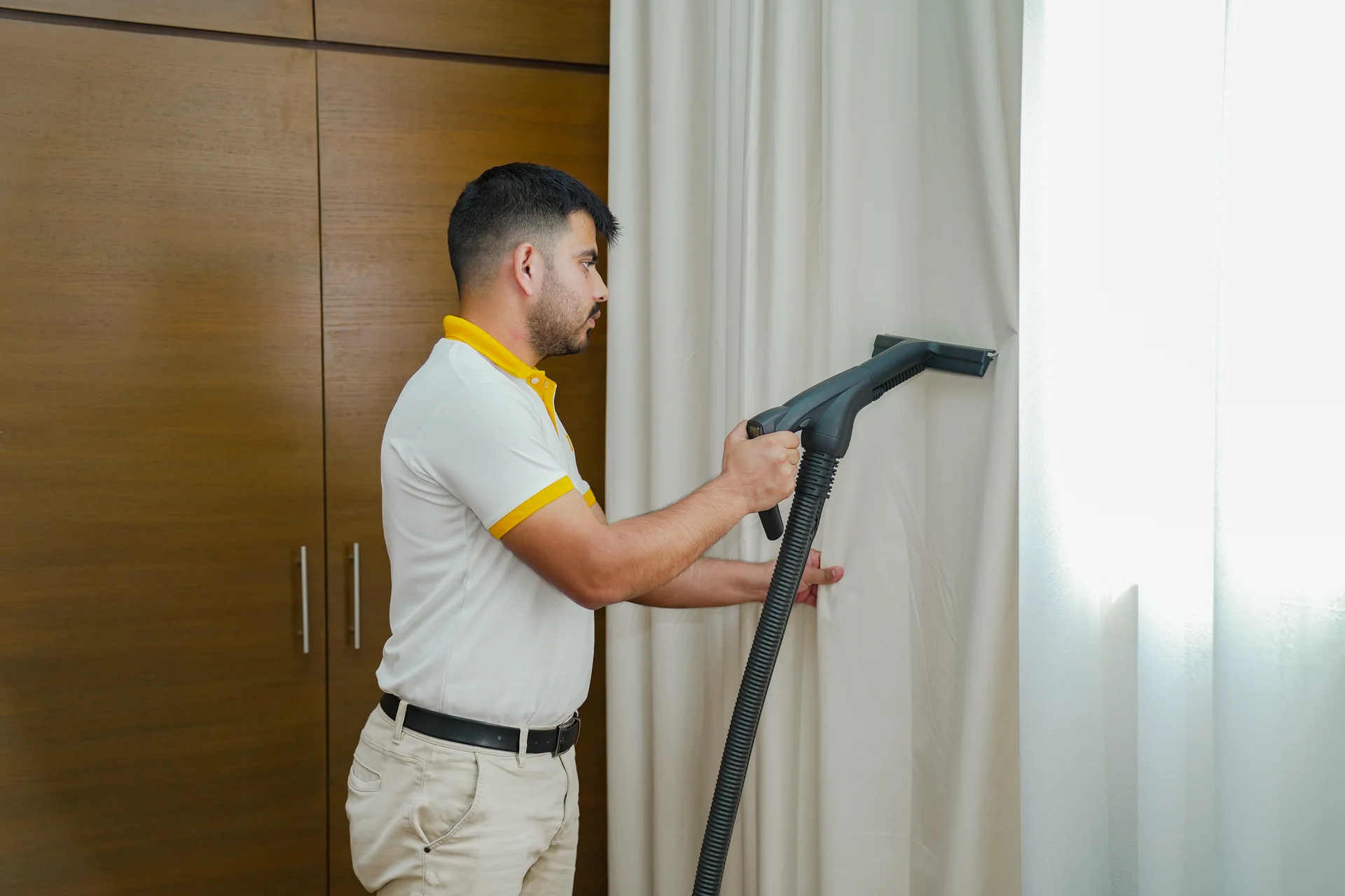 Freshly cleaned curtains in a bright UAE home by DMAIDS