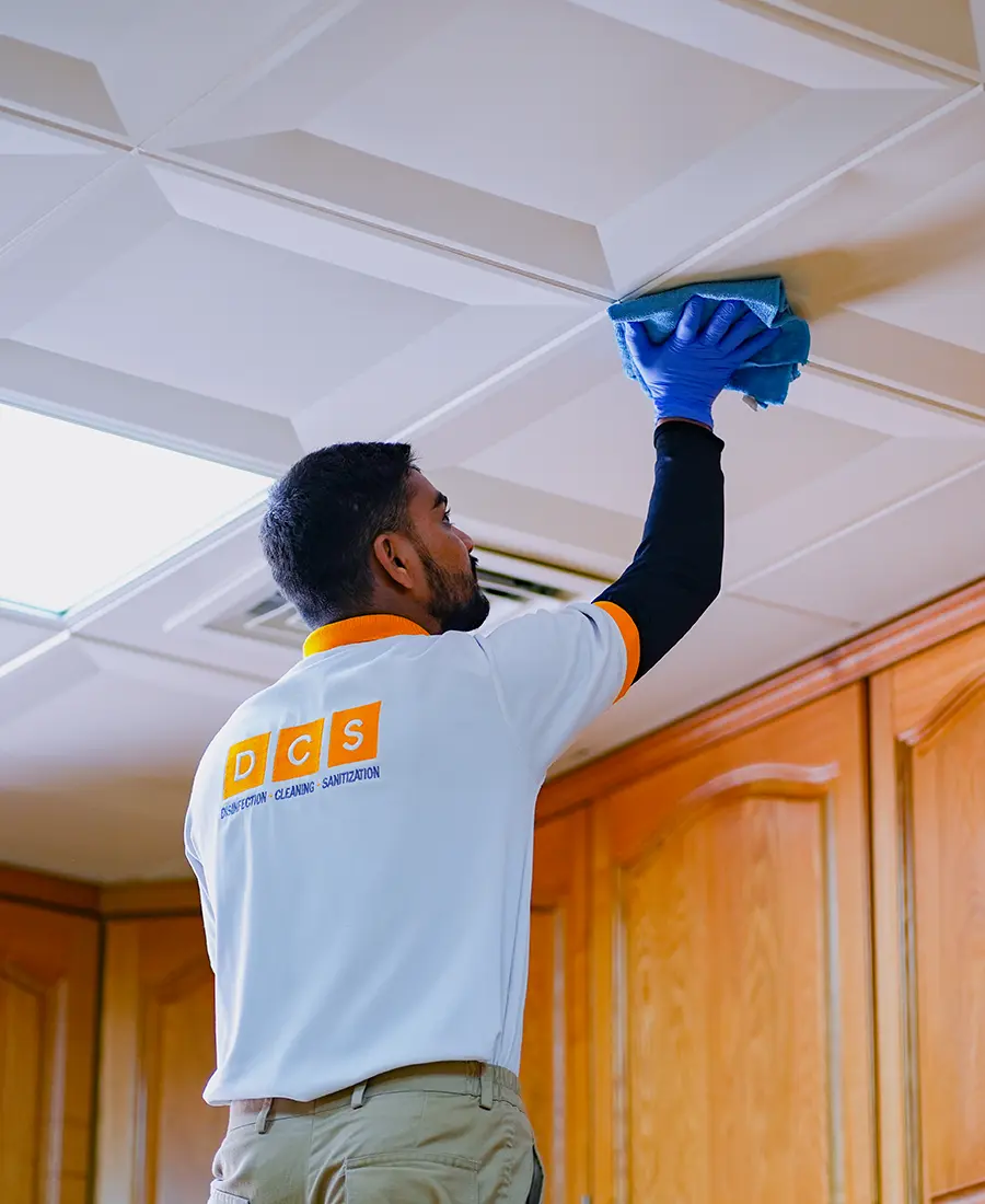 DMAIDS maid cleaning a bright UAE living room