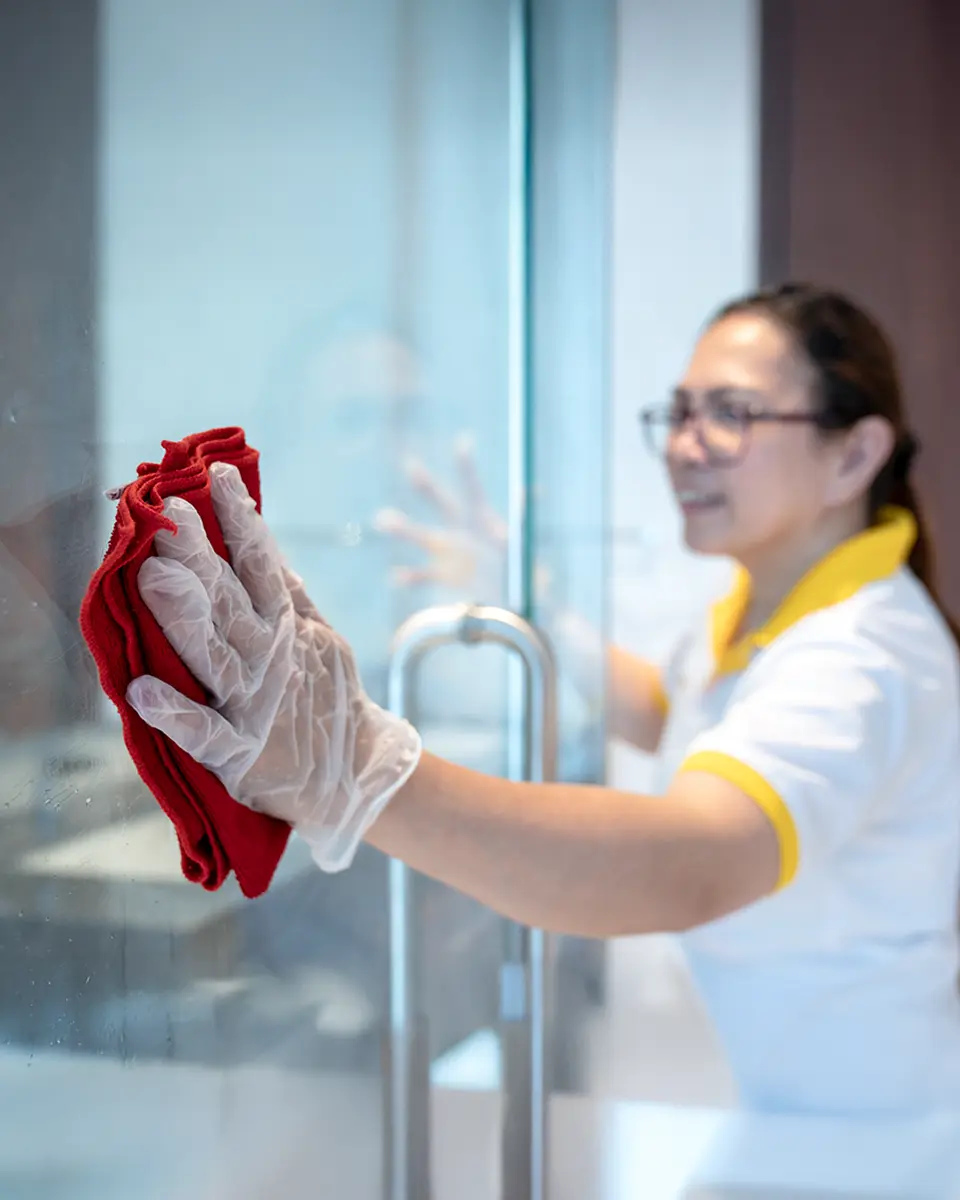 DMAIDS maid cleaning a bright UAE living room